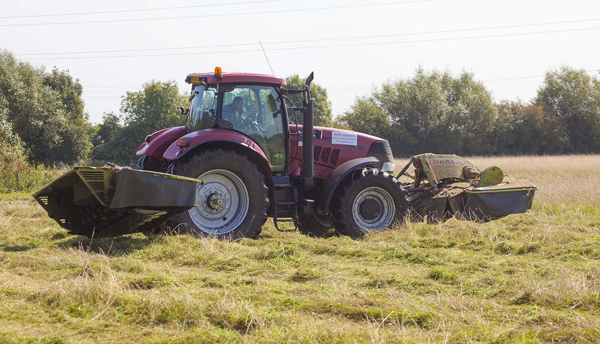Photo of a tractor cutting hay - copyright Mike Dodd