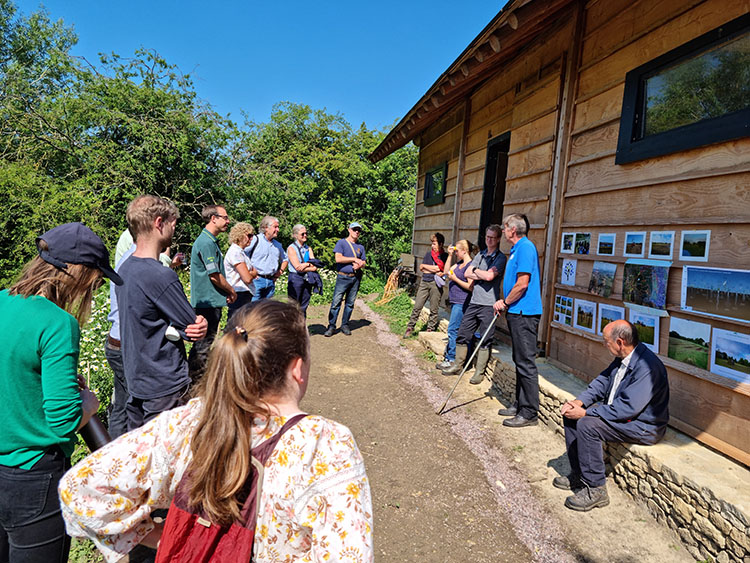 Image of people outside talking at Long Mead