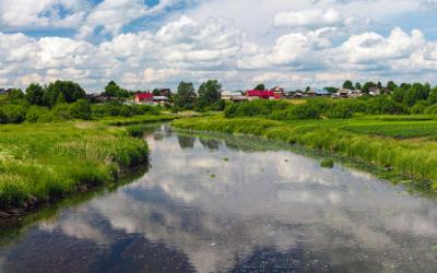 Image of a river flowing through meadows